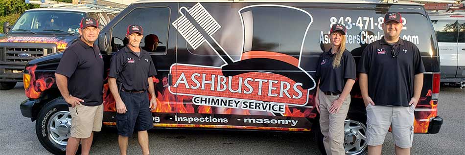 4 technicians in front of ashbusters truck