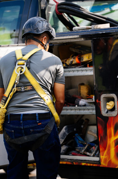 Technician removing tools from van